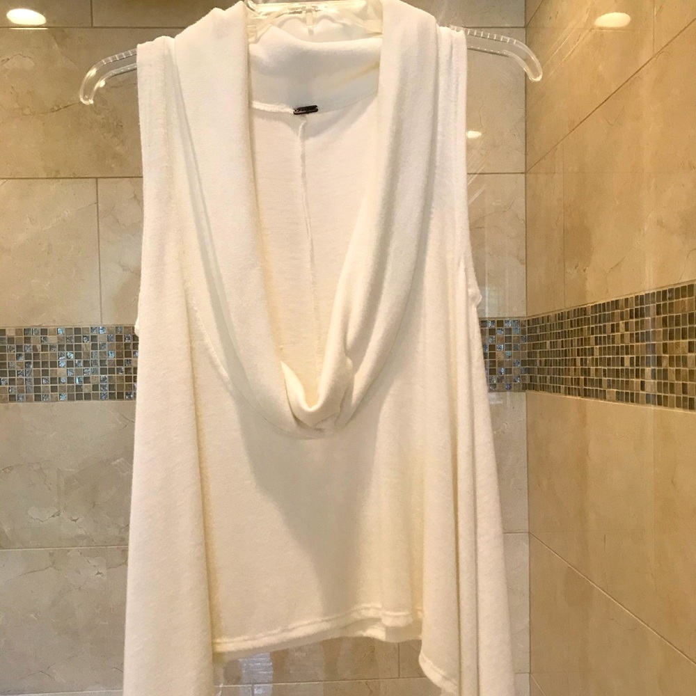 Cowell neck, handkerchief hem, sleeveless sweater